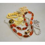 A quantity of vintage jewellery including a silver fuschia brooch, paste set necklace,