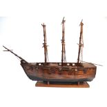 A large scratch built wooden model of a ten gun two deck man o'war ship, on wooden stand,