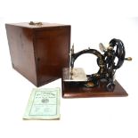 A Willcox & Gibbs 1883 patent sewing machine,