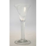 An antique drinking glass having a drawn trumpet bowl decorated with a wheel etched portrait of