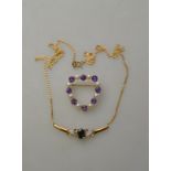 Heart shaped amethyst and cultured pearl open style brooch fitted with safety catch stamped 9ct