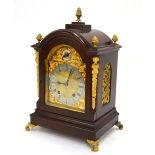 A late 19th Century German mahogany mantle clock,