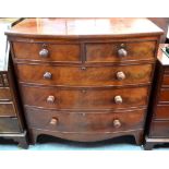 A 19th century mahogany bowfront chest of two short over three long graduated drawers retaining