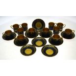 A set of twelve Royal Worcester coffee cans and saucers,