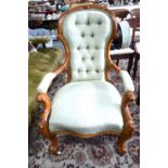 Victorian walnut spoon back armchair with button back over a serpentine seat