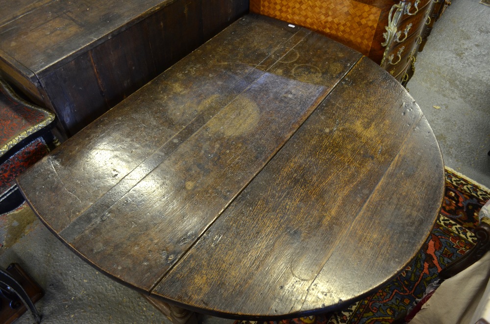 A 17th century oak gateleg table, the pl