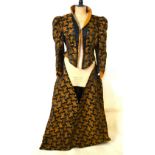 A Victorian black silk open over-dress w