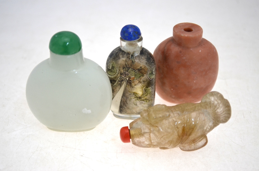 Four Chinese snuff bottles, including: o