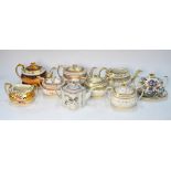 A collection of teapots and sugar boxes