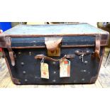 A canvas leather bound cabin trunk with