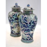 A pair of famille rose vases, domed cove