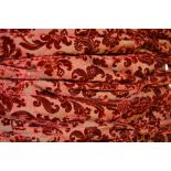 A pair of deep red velvet damask curtain