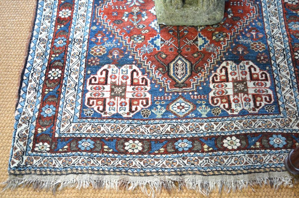 A Persian Qashqai rug, garden design on