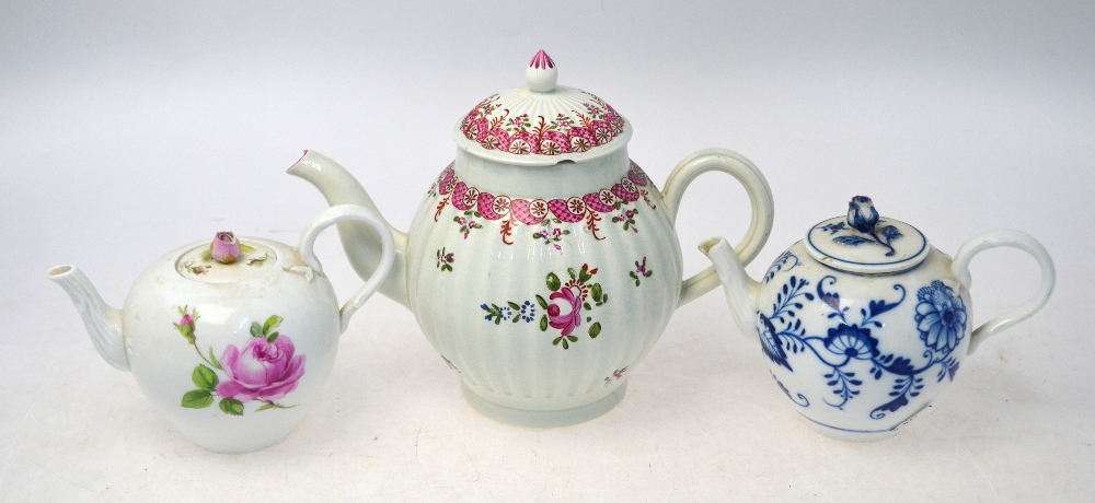 Three teapots, all with lids, comprising