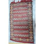 A worn antique Shirvan rug, the four dia