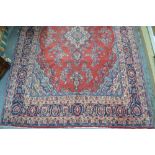 A Persian Hamadan carpet, symmetrical fl