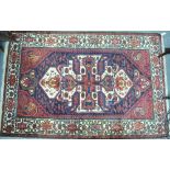 A Persian Bakhtiari rug, dark blue and c