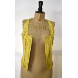 A 1970s yellow leather bodice, a purple