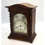 A German walnut cased mantel clock, the