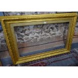 An antique rectangular giltwood picture