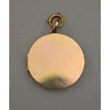 A 15ct gold circular pendant locket engraved to reverse 'Dickie 21-11-20', and inside 'Nov 30th',