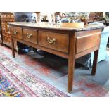 WITHDRAWN An antique French elm low dresser,