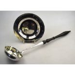 An Imperial Russian punch ladle with turned and ebonised handle, silver stem and oval bowl, 84 zol,.