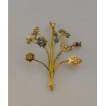 A spray brooch formed of ten various antique stick pins/ring parts, including diamond, seed pearl,