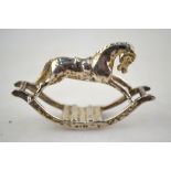 Sarah Jones: a miniature cast silver rocking horse, London 1989,