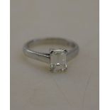 A single stone emerald cut diamond ring in 950 platinum four claw setting c/w GIA certificate