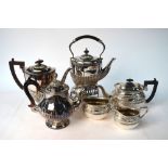 An epns three-piece tea service with chased decoration, to/w a half-reeded kettle on stand,