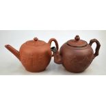 Two red/brown stoneware teapots; one with white metal mounted spout decorated with floral designs,