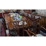 A set of fourteen Georgian style mahogany dining chairs having pierced and moulded splats over