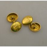 A pair of oval gold cufflinks, monogrammed and engraved Christmas 1907,