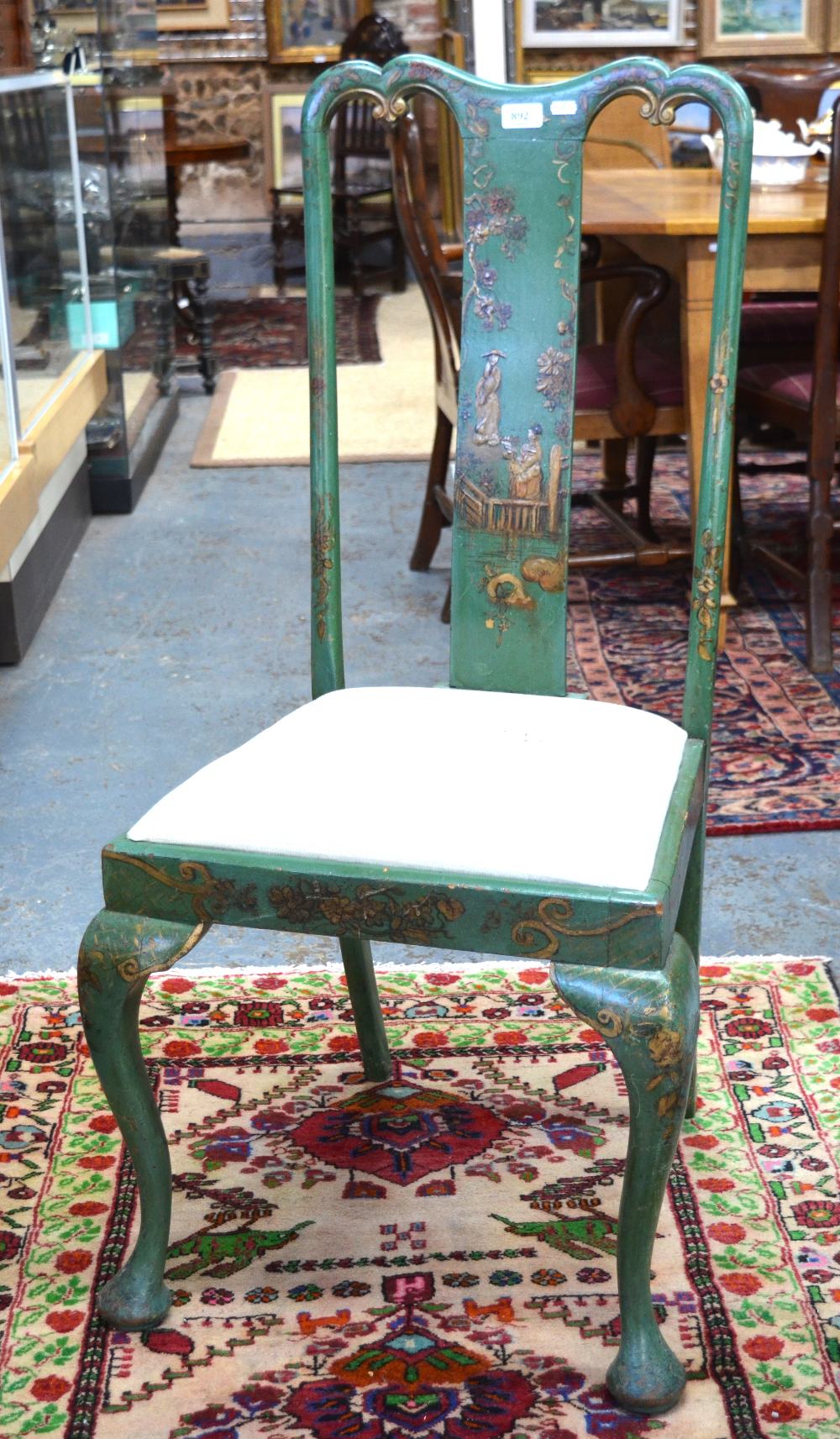 An antique green lacquered and gilt japanned side chair with slip seat on club front legs to pad