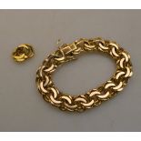 A 9ct gold linked bracelet with spare links,