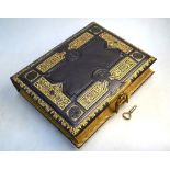 A 19th century richly embossed and gilded leather photograph album with chromolithographic