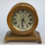 A bell-metal mantel clock with American movement and 8 cm silvered dial,