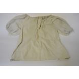 1970's clothing to include; 1970s cream leather shorts and matching blouson top,