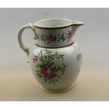 An English pearlware jug decorated with flower sprays beside the legend 'Drink round boyes',