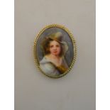 An oval porcelain plaque featuring female with hat,