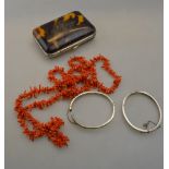 A lot containing two half-engraved silver bangles to/w stick coral necklace and silk lined