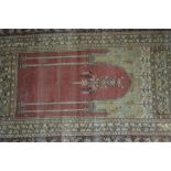 An antique Turkish Milas prayer rug, red-brown ground with mehrab design, 1.80 x 1.