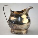 A George III silver cream jug with roulette engraving and reeded rims, Solomon Hougham,