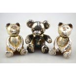 A cast silver 'teddy bear' salt and pepper pair, to/w a 'teddy bear' paperweight by Theo Fennell,