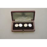 A pair of 9ct yellow and white gold mother of pearl set cufflinks in fitted box retailed by Asprey