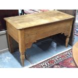 An antique French oak/elm table, the cleated plank top over a plain frieze,