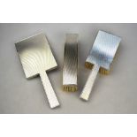 An Art Deco style engine-turned three-piece brush set, Birch & Gaydon,