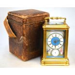 An English brass carriage clock, the alarm/repeater movement striking on a coiled gong,