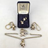 Four silver pendant teddy bears (two as key-rings),